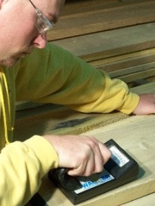 Measuring Moisture in Wood Prior to Production Worker measuring wood moisture